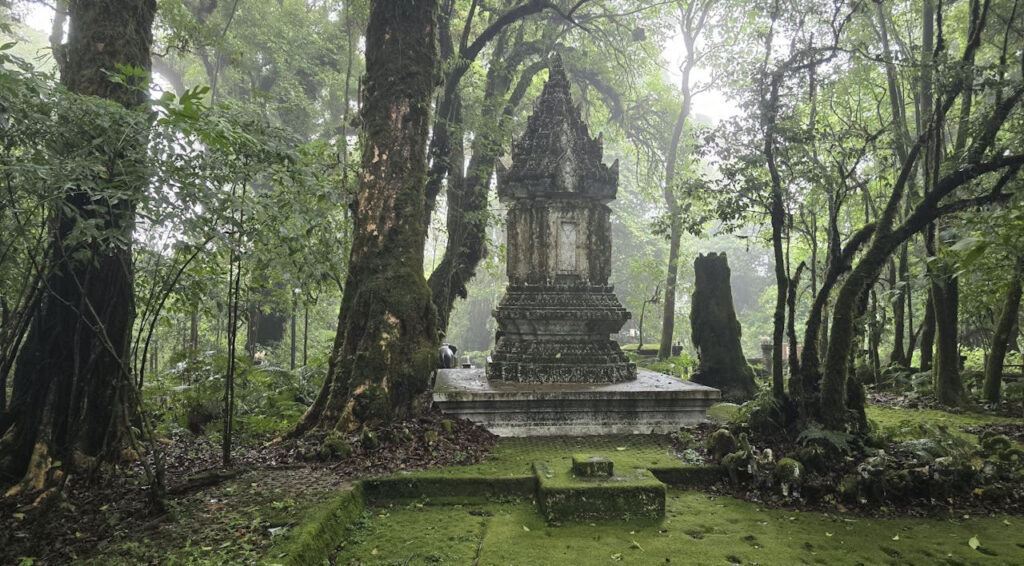 Ancient stone shrine surrounded by moss and mist in the forest of Doi Inthanon National Park, Thailand