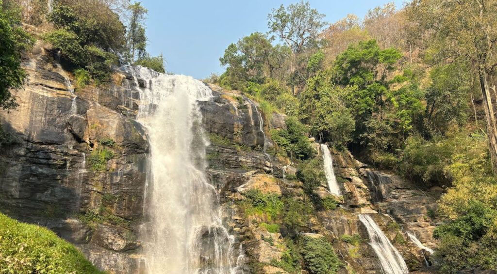 Wide view of Wachirathan Waterfall cascading down rocky cliffs in Doi Inthanon National Park, Thailand