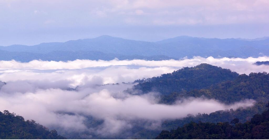 Mist and clouds drifting over forested mountain ridges at Kaeng Krachan National Park, Thailand