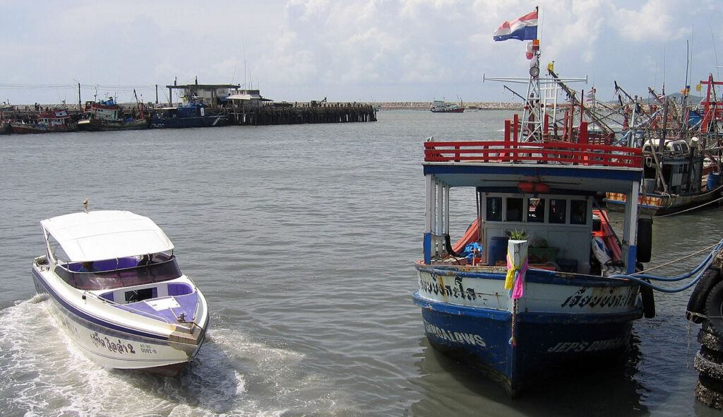 Speedboat and slow ferry at Ban Phe Pier, the main departure point to Koh Samet, Thailand