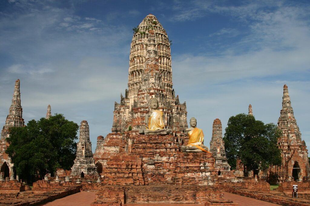 Ancient temple ruins and Buddha statues at Wat Chaiwatthanaram in Ayutthaya, Thailand, a UNESCO World Heritage Site.
