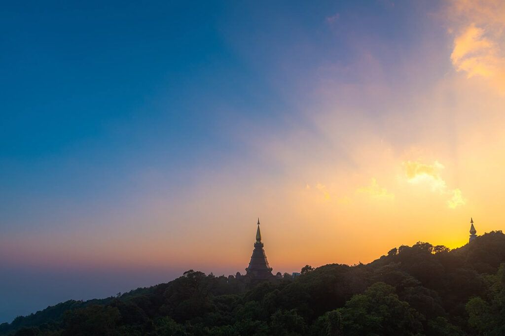 Sunset view of the Twin Royal Pagodas surrounded by forest at Doi Inthanon National Park, Chiang Mai