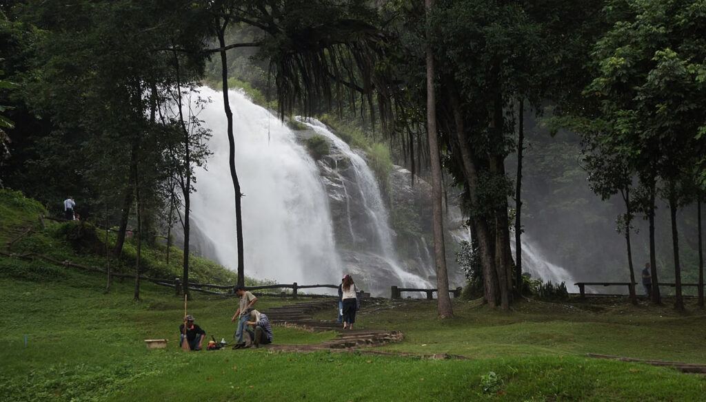 Visitors relaxing near Wachirathan Waterfall in Doi Inthanon National Park, Chiang Mai, Thailand