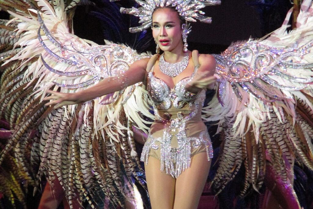 Performer in elaborate costume at a cabaret show in Pattaya, Thailand.