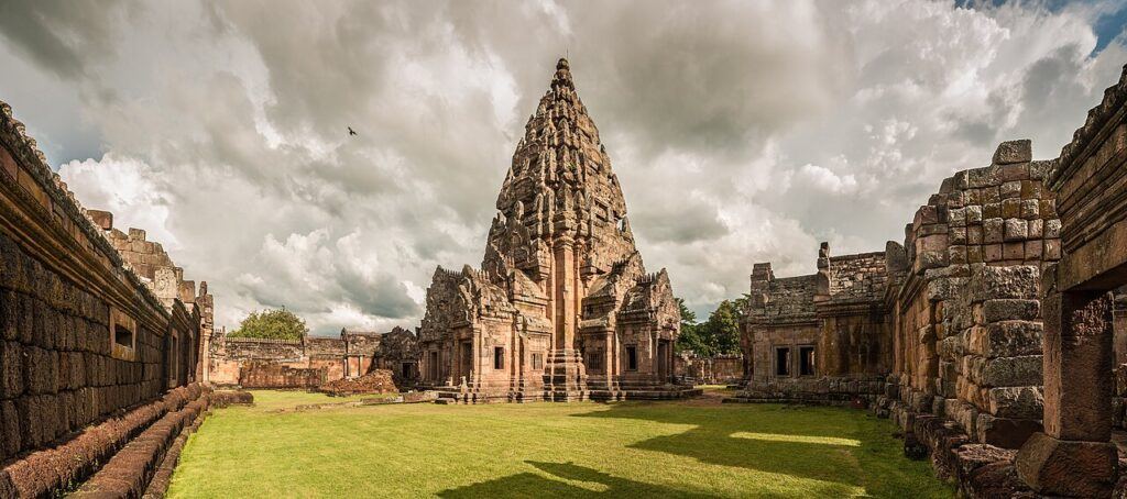 Panoramic view of the main sandstone tower of Phanom Rung Historical Park under dramatic clouds