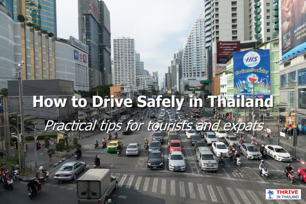Daytime traffic in Bangkok showing cars and scooters sharing a major city intersection