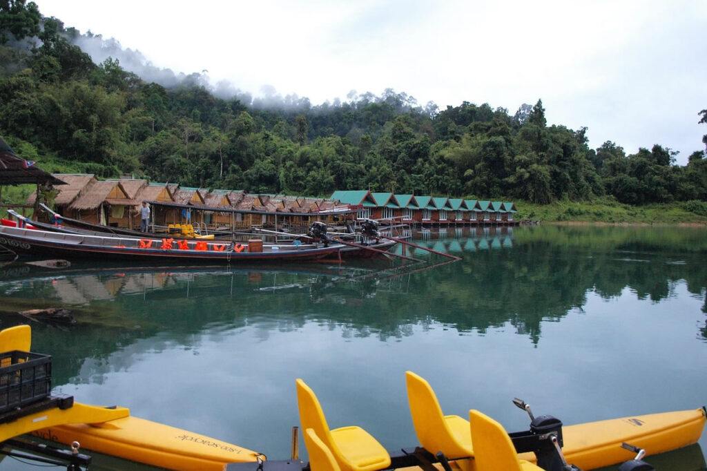 Floating bungalows on Cheow Lan Lake in Khao Sok National Park with calm water and jungle backdrop