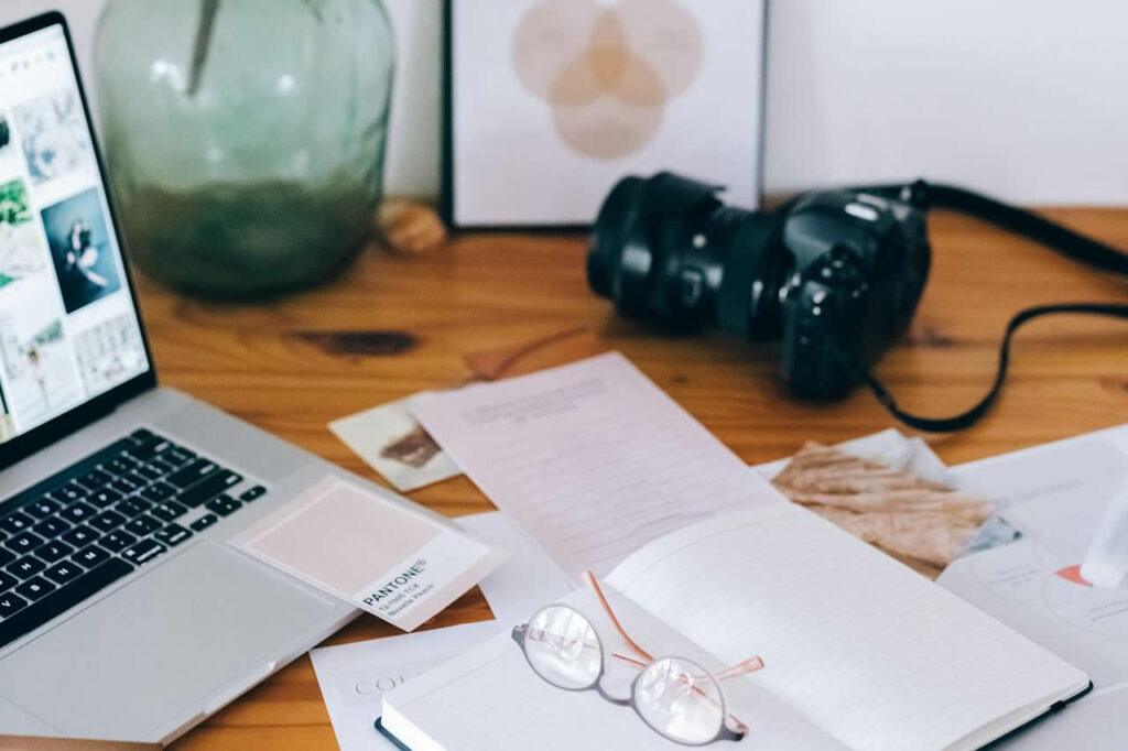 Calm indoor workspace with laptop and natural light representing focused online work while living in Thailand