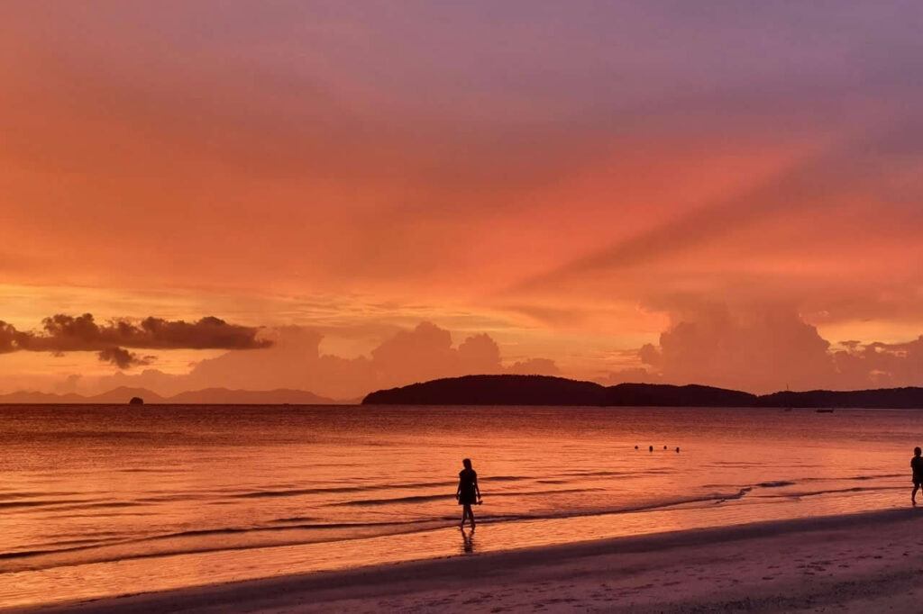 1) Featured Image (already chosen)

Your realistic wooden desk / coffee / notebook hero image.

Purpose:
Sets the tone immediately: calm, thoughtful, realistic. Not hype. Not nomad cliché.

2) Lanterns by the river at dusk (Chiang Mai)

The warm lantern / riverside evening scene

Purpose in story:
This visually represents why people start thinking about online income in Thailand.
Lifestyle first. Work second.

This fits perfectly after:

“Living in Thailand has a way of changing how you think about work and money.”

3) The empty table on the pier overlooking the sea

Rustic table, umbrella, open horizon

Purpose in story:
This is the digital nomad fantasy image. Freedom. Space. Possibility.

Place this near the section:

“Common Online Income Myths”

It visually represents the idea people have before reality hits.

4) The indoor laptop desk by the window (plant, globe, mug)

Person typing at desk in calm room

Purpose in story:
This is the transition image.
From dream → to actual quiet, repeatable work.

Perfect near:

“What Actually Works Long-Term: Skill-Based Online Income”

5) The messy creative desk (camera, papers, glasses, laptop)

Creative chaos workspace

Purpose in story:
Represents real effort, trial and error, learning, building, imperfection.

Place near:

“The Real Reasons Most Beginners Fail”

This image feels human and honest.

6) Top-down laptop image (hands on keyboard, clean desk)

Structured, organized, focused

Purpose in story:
This is the clarity phase. After confusion, things become structured.

Fits beautifully near:

“What a Realistic Online Income Path Actually Looks Like”

7) Beach at blue hour with two people walking in shallow water

Peaceful twilight beach

Purpose in story:
Represents time, patience, calm progress.

Place near:

“Thailand Rewards Patience”

This one is emotionally powerful and perfectly aligned.

8) Sunset beach with person walking along shore

Golden sunset, solitary figure

Purpose in story:
This is the closing emotional image before FAQ / end.

It says:

This is what the long game gives you.

Place just before:

FAQs or final section