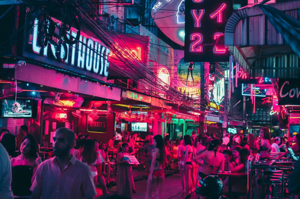 Busy nightlife street in Bangkok showing bars and entertainment venues in Thailand