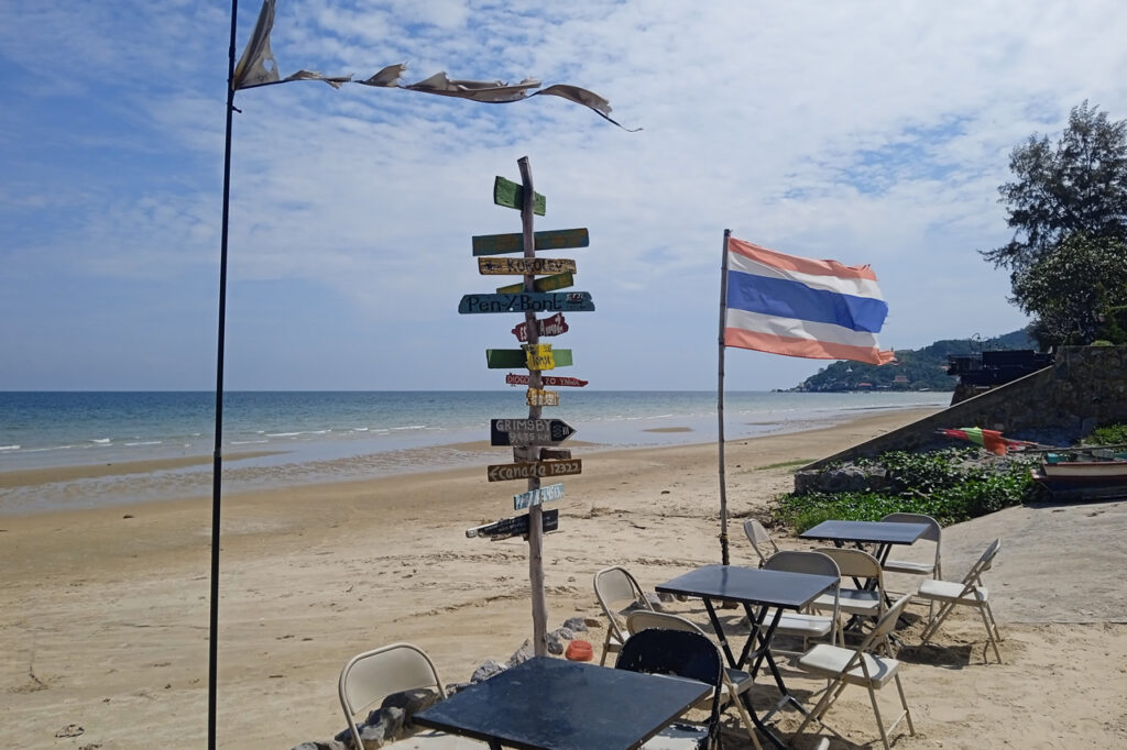 Beachfront café in Hua Hin with Thai flag and ocean view