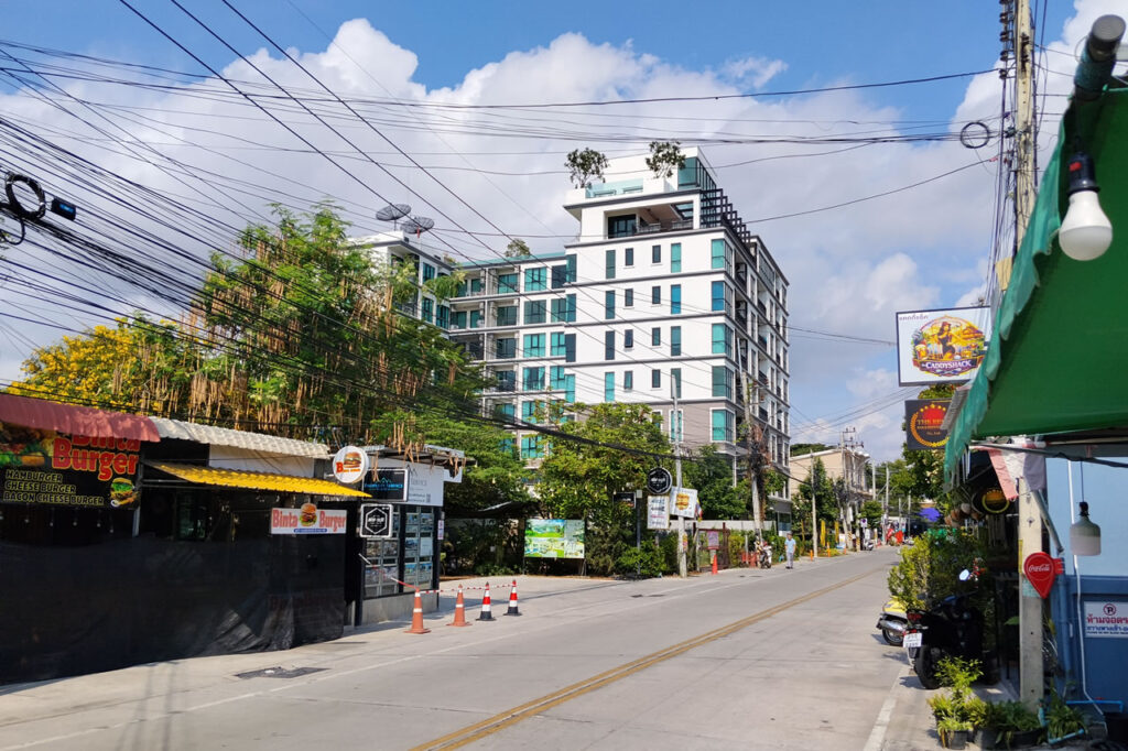 Condo buildings, restaurants, and street atmosphere along Soi 94 in central Hua Hin.