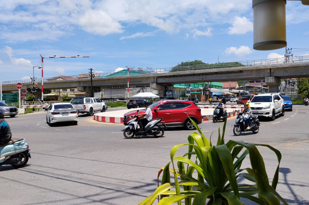 Traffic at the roundabout beneath the railway overpass in Hua Hin, Thailand.