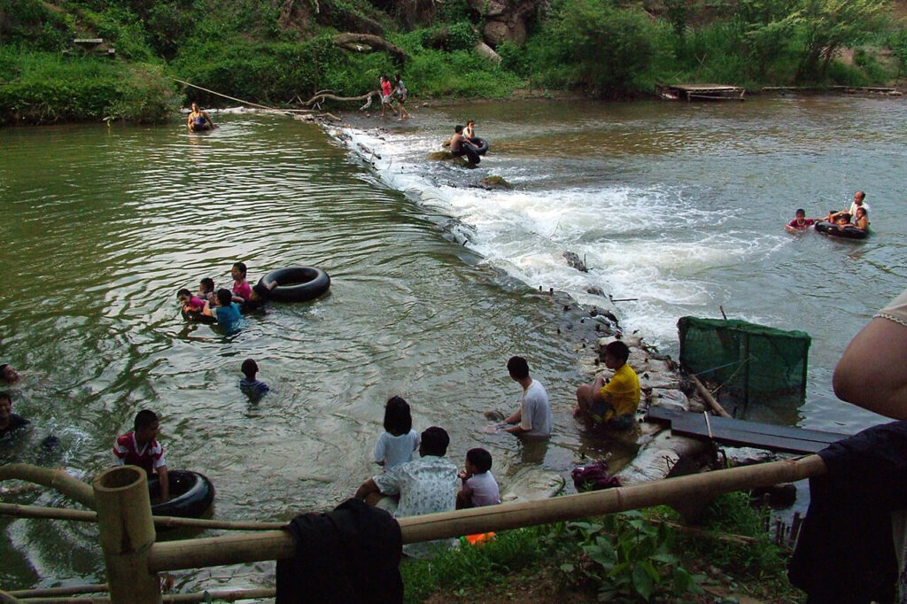 Families enjoying a river in the Chiang Mai countryside