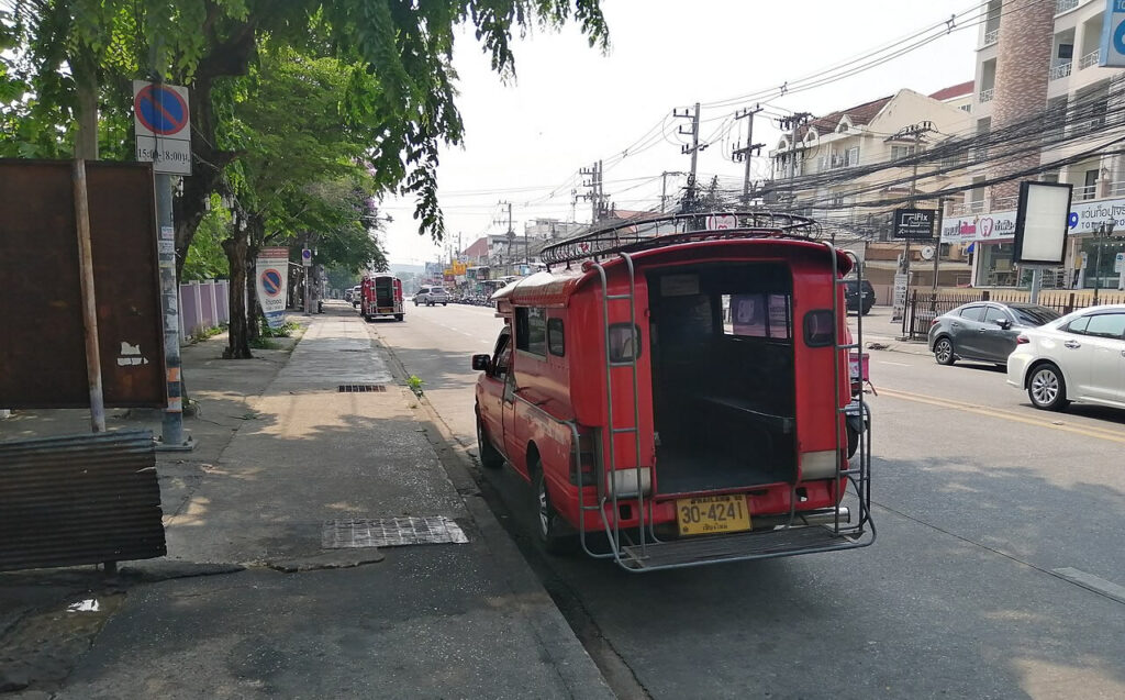 Red songthaew used for local transport in Chiang Mai