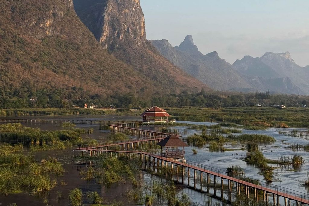 Bueng Bua wetland boardwalk beneath the limestone mountains of Sam Roi Yot National Park