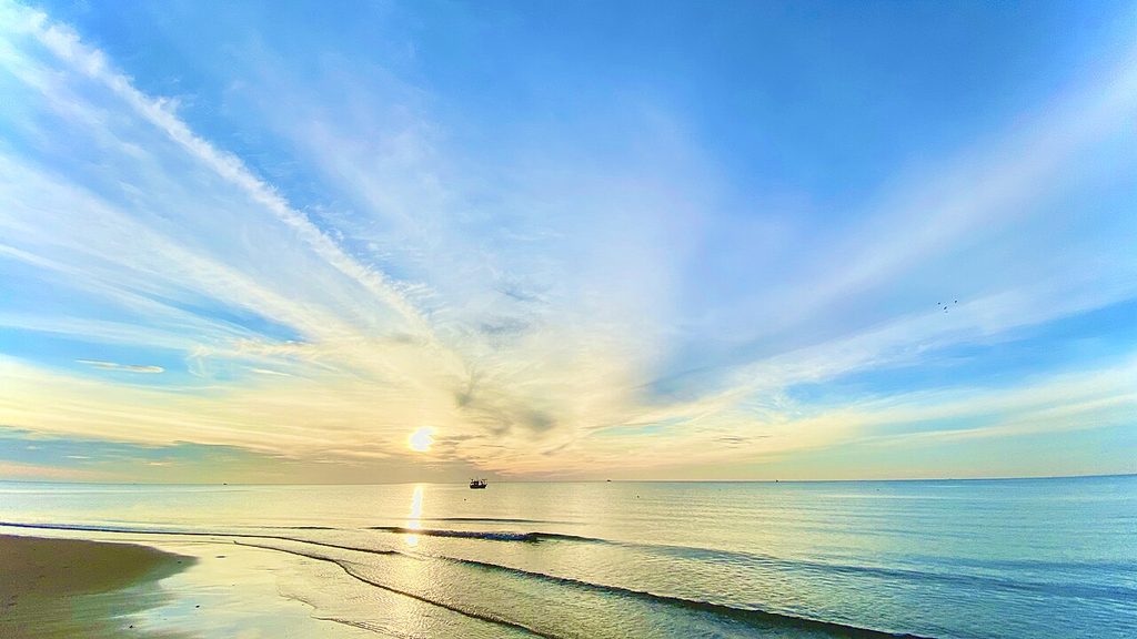 Sunrise over the calm sea at Ban Krut Beach