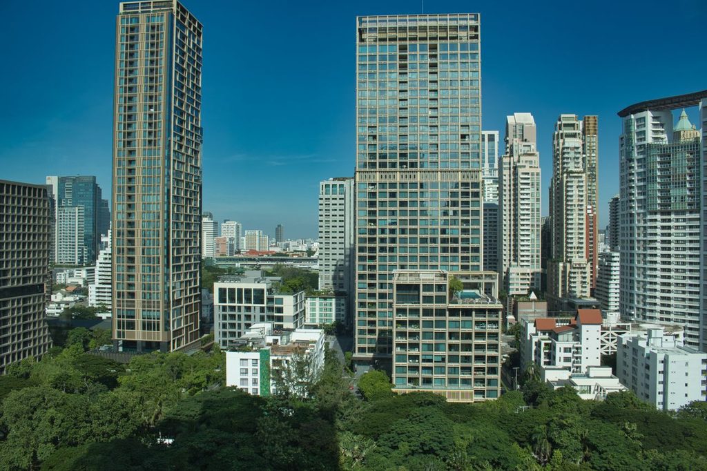 High-rise residential buildings overlooking trees and neighbouring buildings in Bangkok